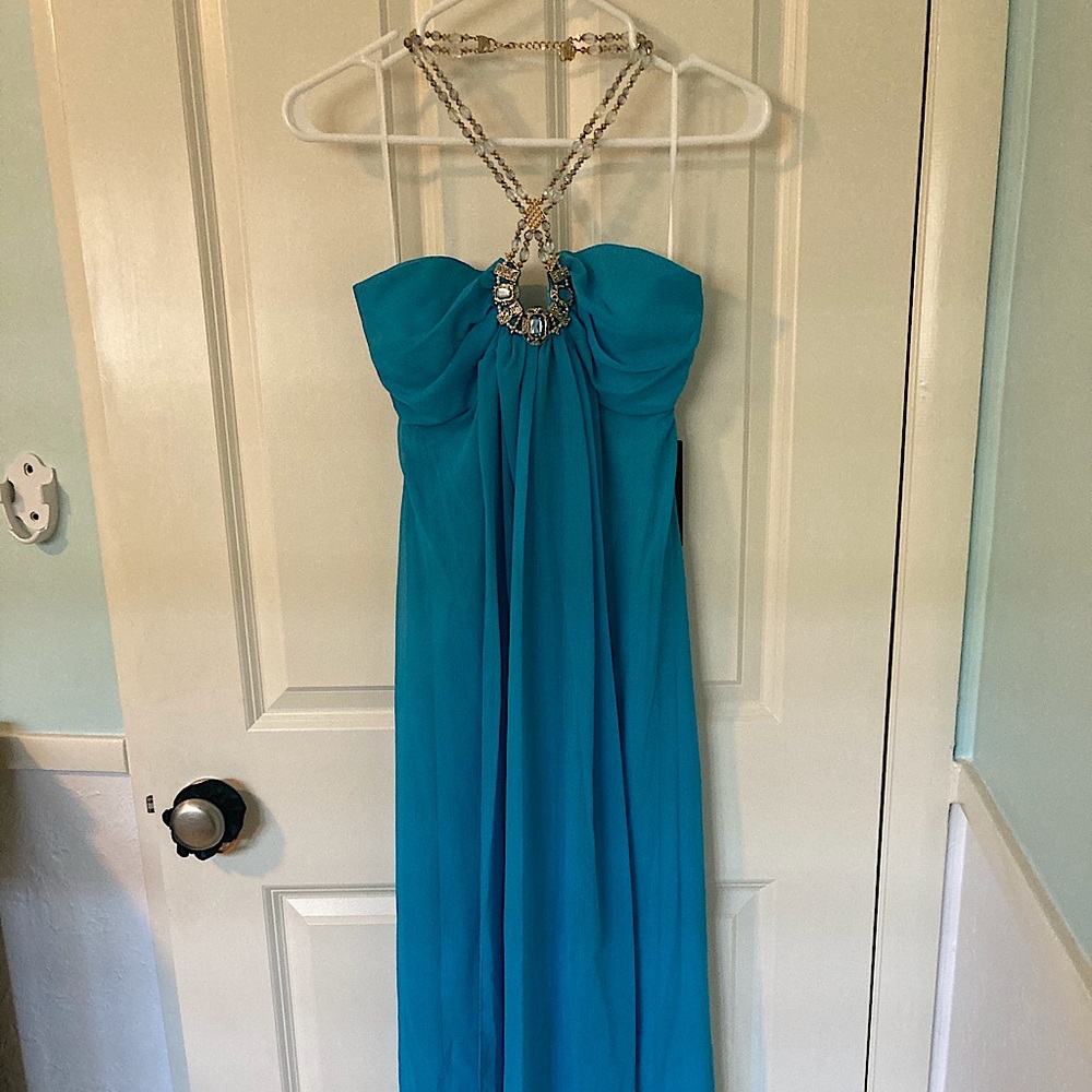 Blue maxi dress with unique beaded necklace.